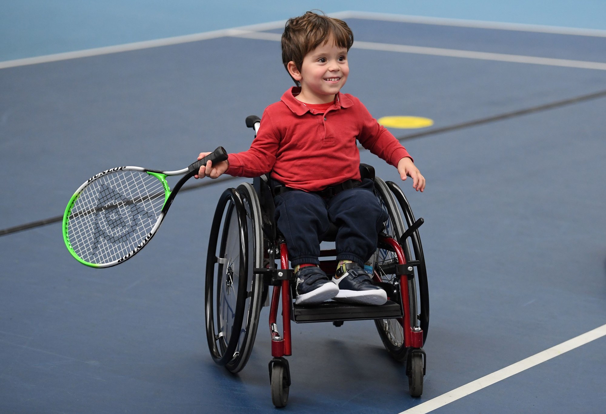 Junior wheelchair player taking part in an LTA Wheelchair Tennis Initiative day