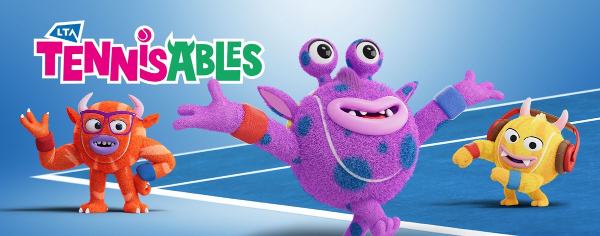 Three LTA Tennisables characters standing on a tennis court