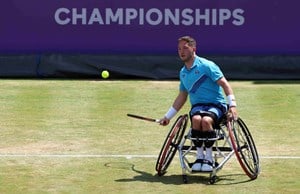 British wheelchair player Alfie Hewett hits a forehand on court at the cinch Championships