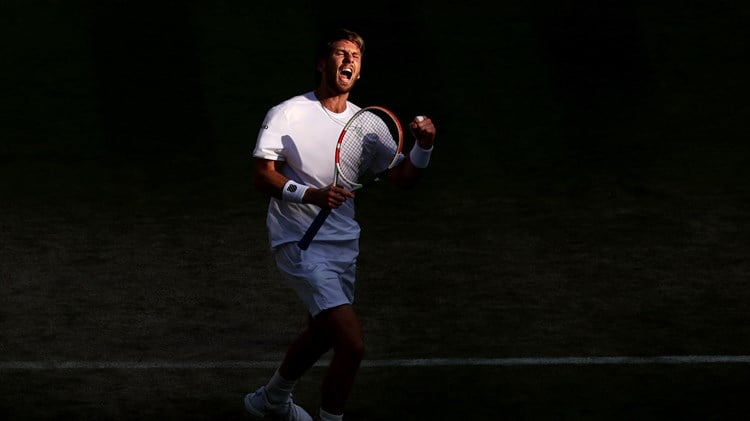 Cam Norrie celebrates a point against David Goffin during their men's singles quarter-final match on day nine of The Championships Wimbledon 2022 