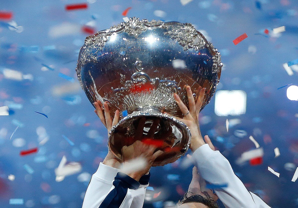 Close up of player holding up Davis Cup.jpg