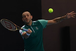 Dan Evans hits a volley at the China Open