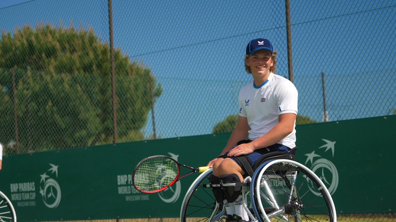 Wheelchair tennis star Ben Bartram sat in his wheelchair on court at the World Team Cup while holding his tennis racket