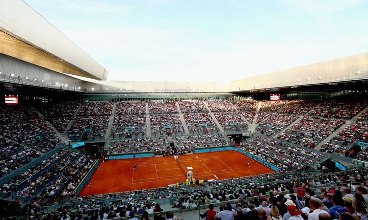 Clay court match in a stadium
