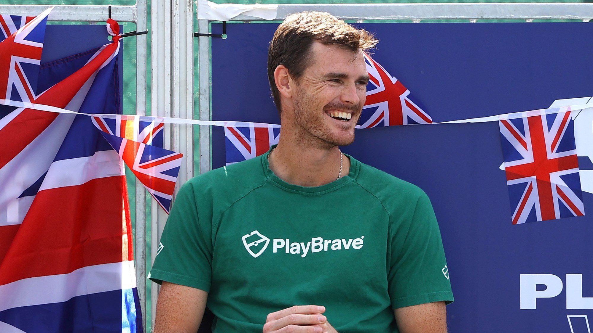 Jamie Murray watches on and smiles