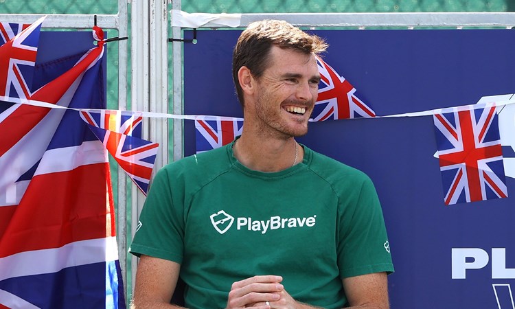 Jamie Murray watches on and smiles