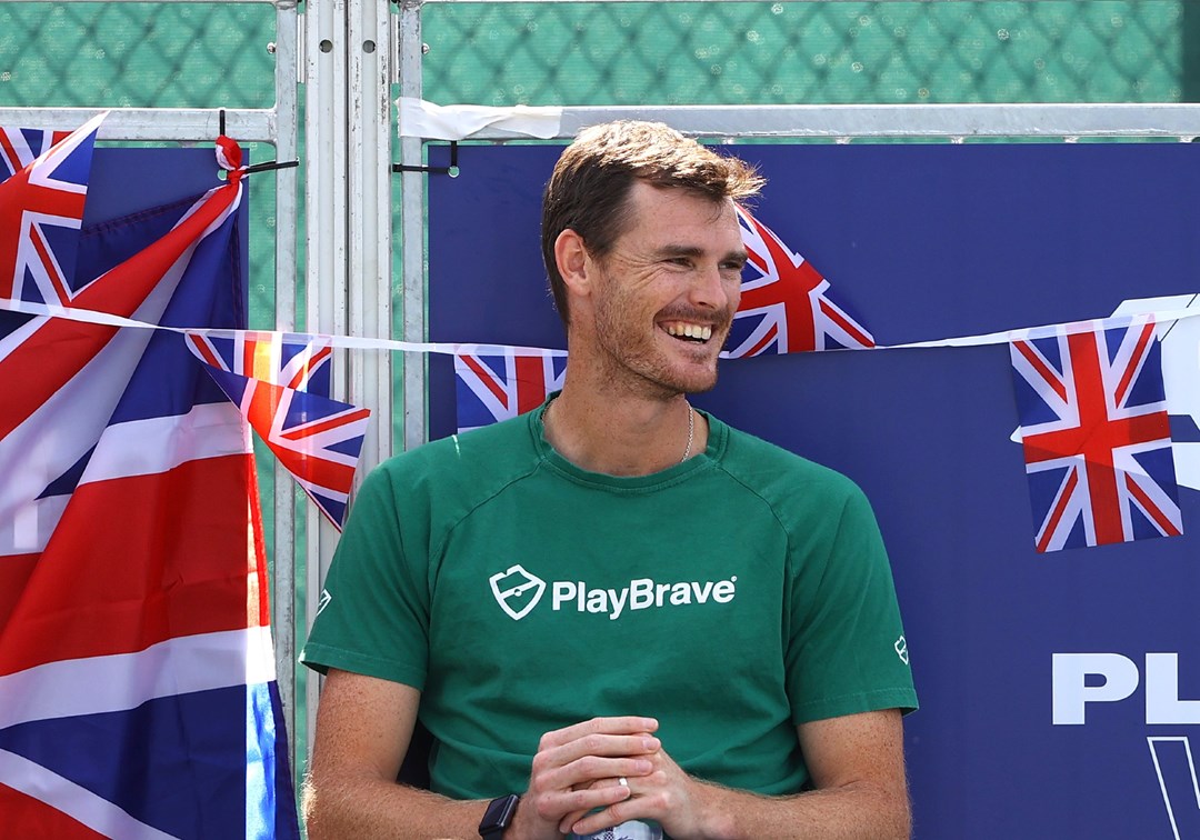 Jamie Murray watches on and smiles