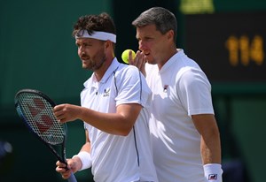 Jonny O'Mara and Ken Skupski discussing tactics at Wimbledon 2022