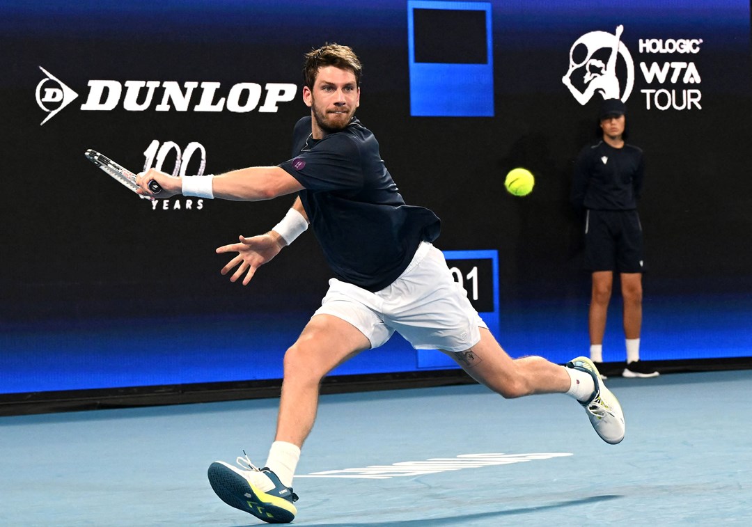 Cam Norrie stretches for a backhand against Taylor Fritz at the United Cup