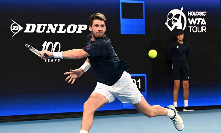 Cam Norrie stretches for a backhand against Taylor Fritz at the United Cup