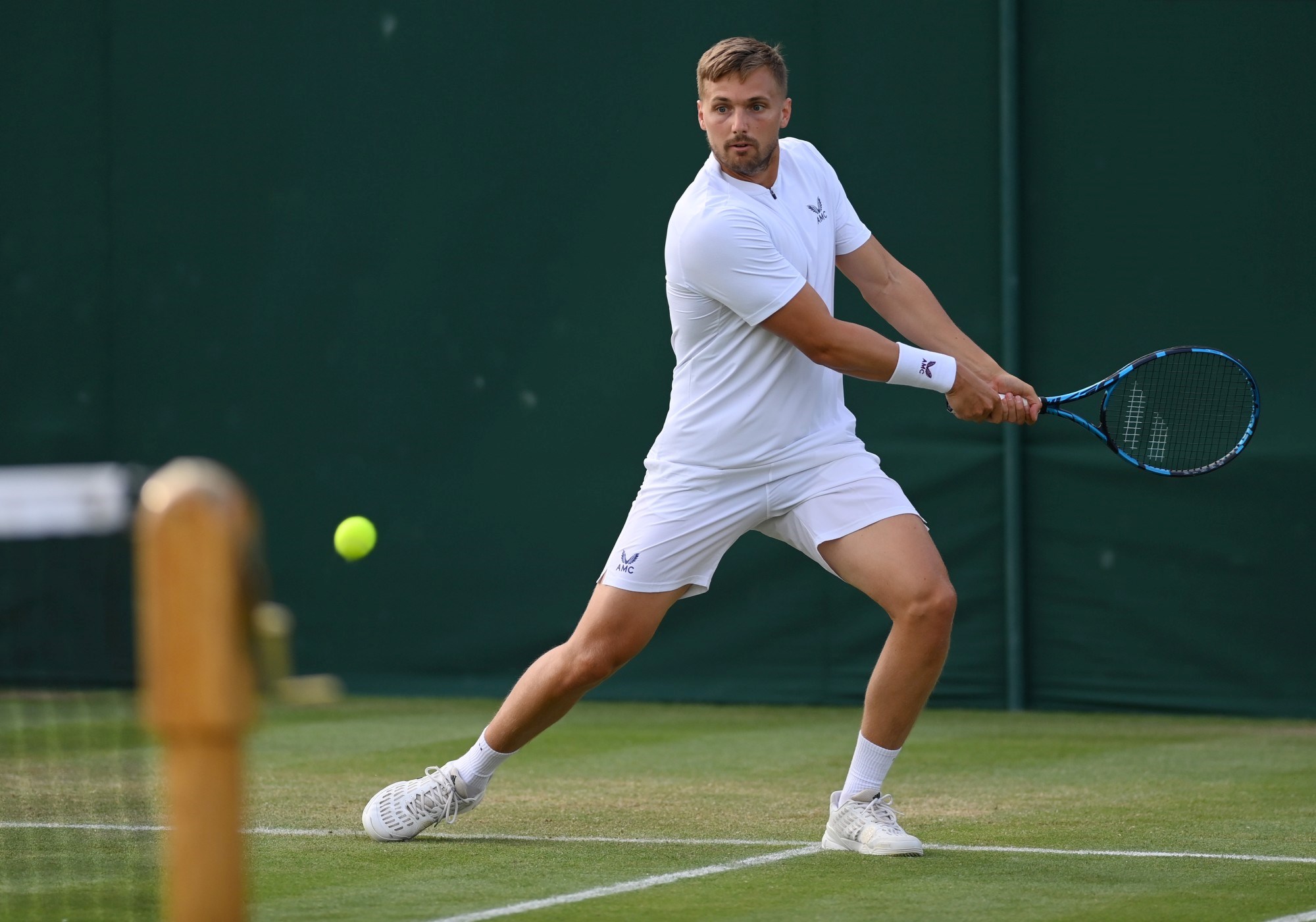 Lloyd Glasspool of Great Britain, playing partner of Harri Heliovaara of Finland plays a forehand during his men's doubles first round match against Wesley Koolhof of Netherlands and Jean-Julien Rojer of Netherlands during Day Four of The Championships - Wimbledon 2021 at All England Lawn Tennis and Croquet Club on July 01, 2021
