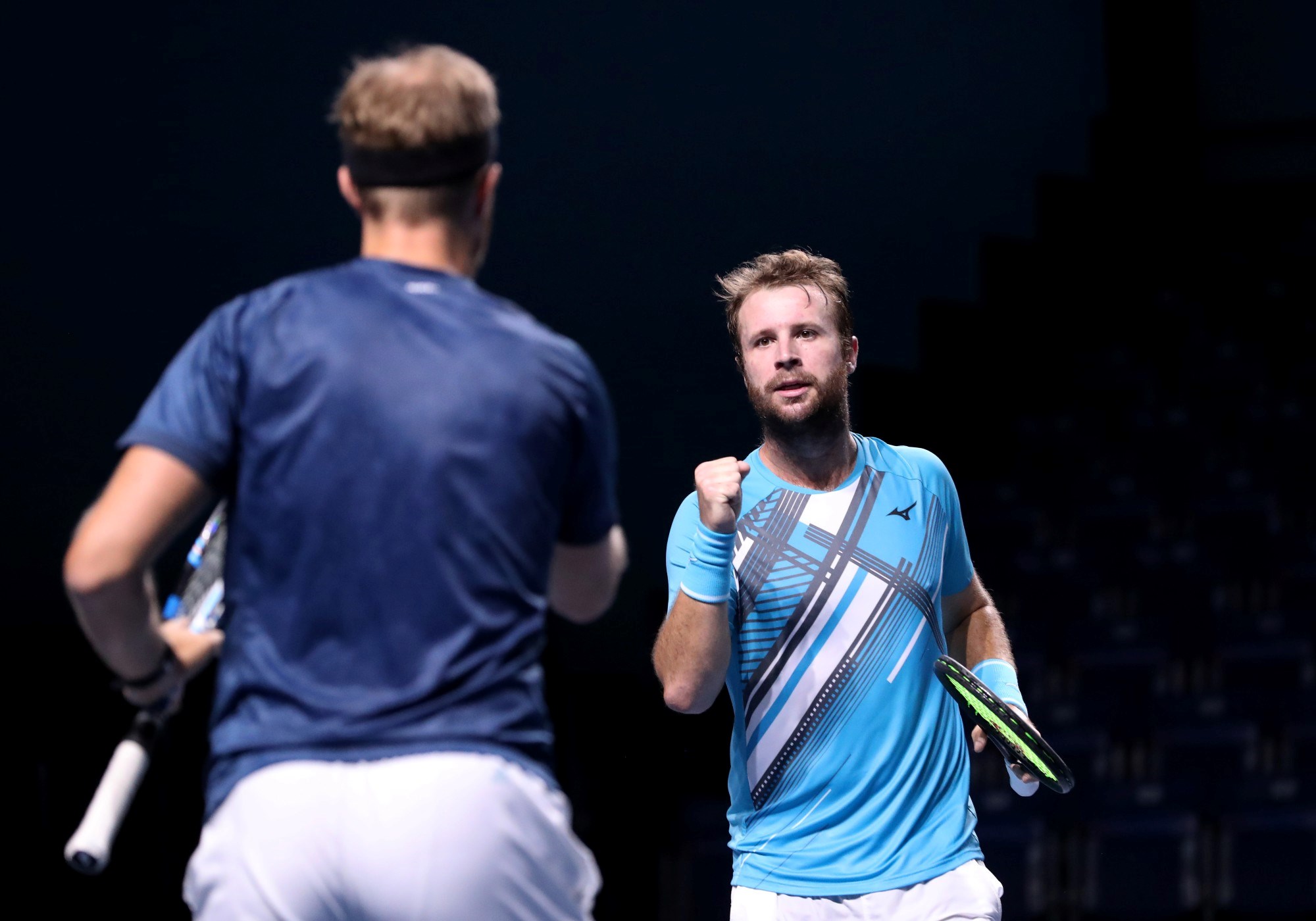 Luke Bambridge (R) and Dominic Inglot of Great Britain celebrate a point in their Men's Doubles Quarterfinals match against Jamie Cerretani of the United States and Adil Shamasdin of Canada on day four of the Singapore Tennis Open at the OCBC Arena on February 25, 2021