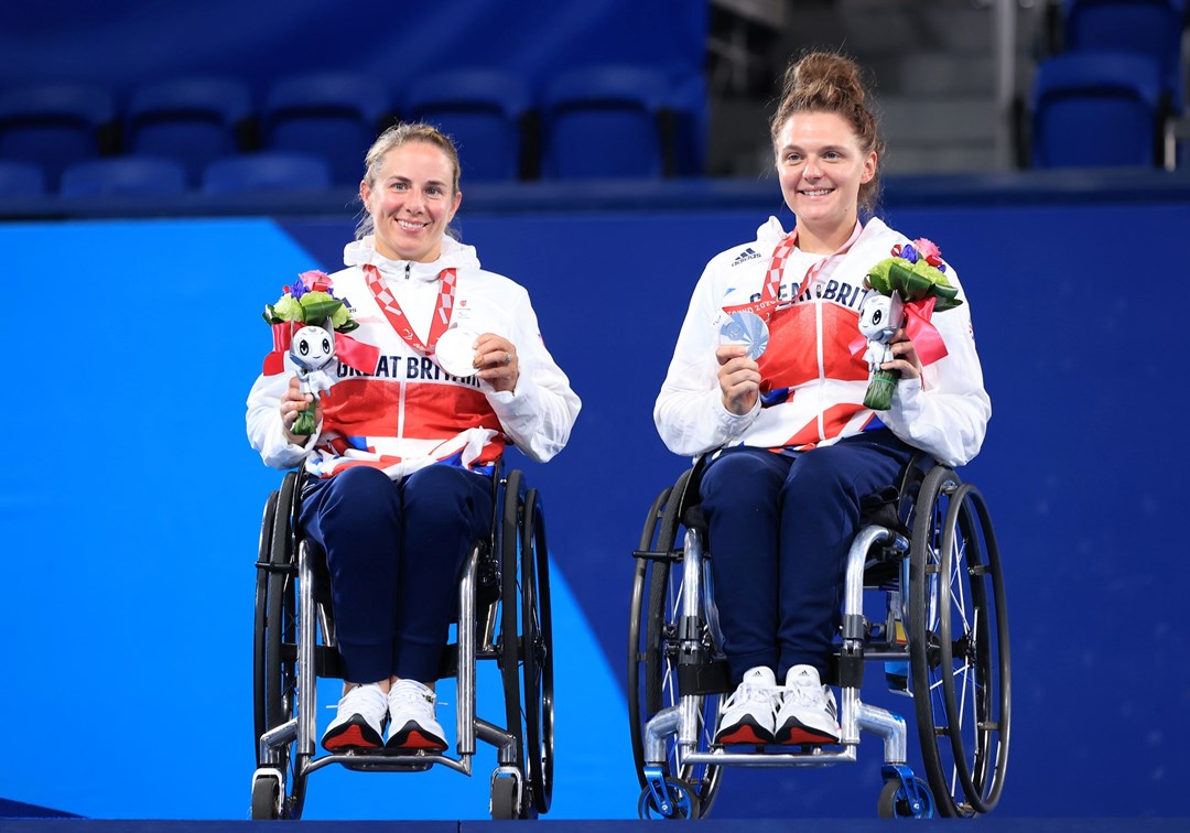 Silver medalist Lucy Shuker (L) and Jordanne Whiley of Team Great Britain celebrate during the medal ceremony for the Women's Doubles Gold Medal Match on day 11 of the Tokyo 2020 Paralympic Games a