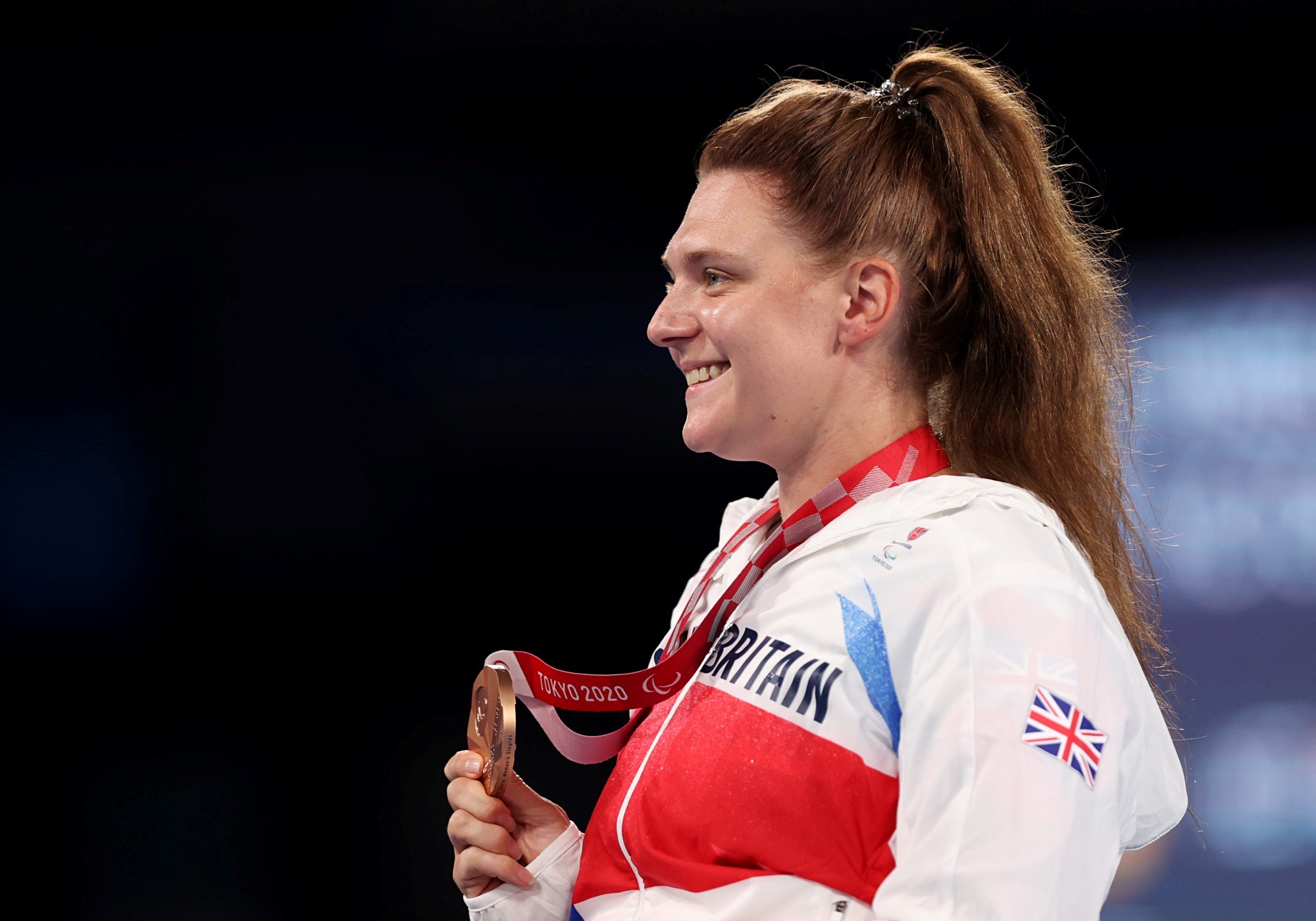 Jordanne Whiley of Team Great Britain celebrates with the bronze medal during the medal ceremony for the Wheelchair Tennis Women's Singles on day 10 of the Tokyo 2020 Paralympic Games