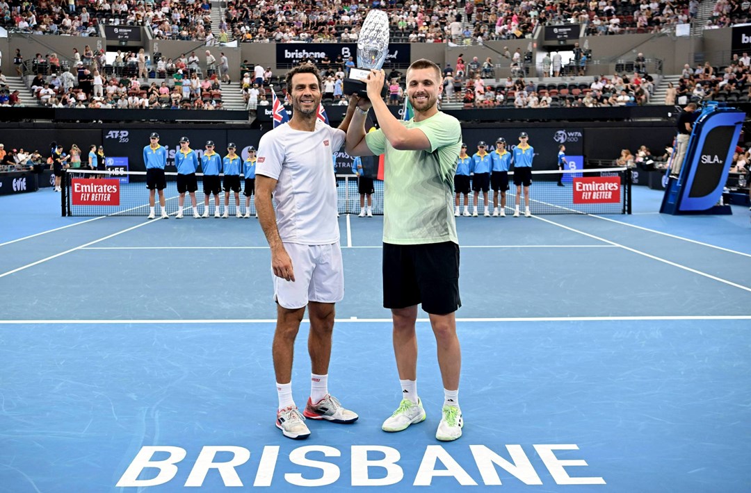 Jean-Julien Rojer and Lloyd Glasspool holding the Brisbane International title