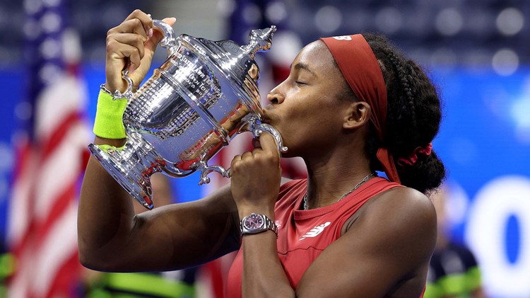 2023 US Open women's singles champion Coco Gauff holding her championship trophy while on court at the US Open 