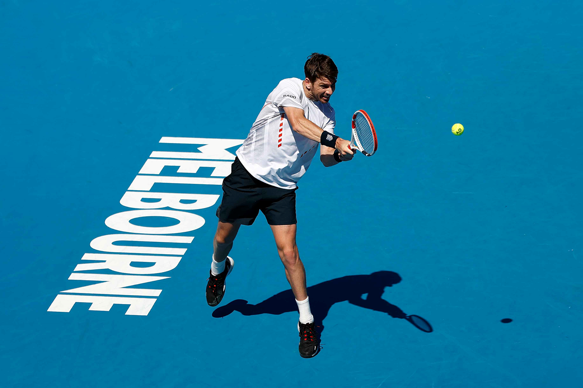 Cam Norrie hitting a backhand at the Australian Open 2022