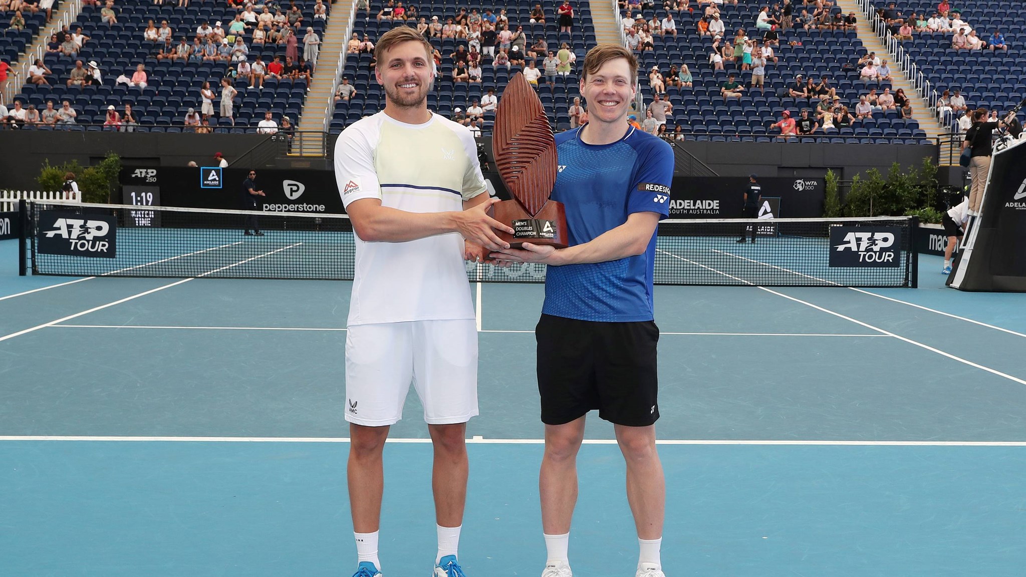 Lloyd Glasspool and Harri Heliovaara holding the 2023 Adelaide doubles title