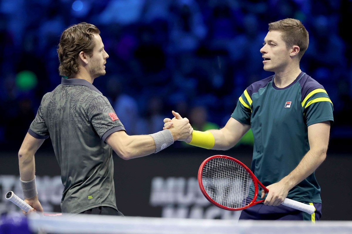 Neal Skupski and doubles partner Wesley Koolhof sharing a handshake