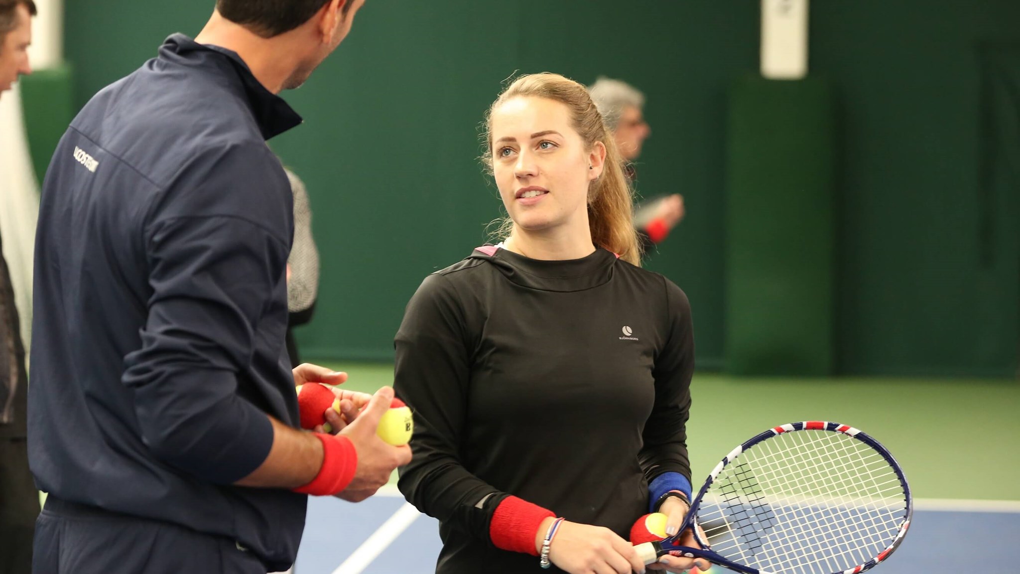 Two coaches chatting at coach conference 