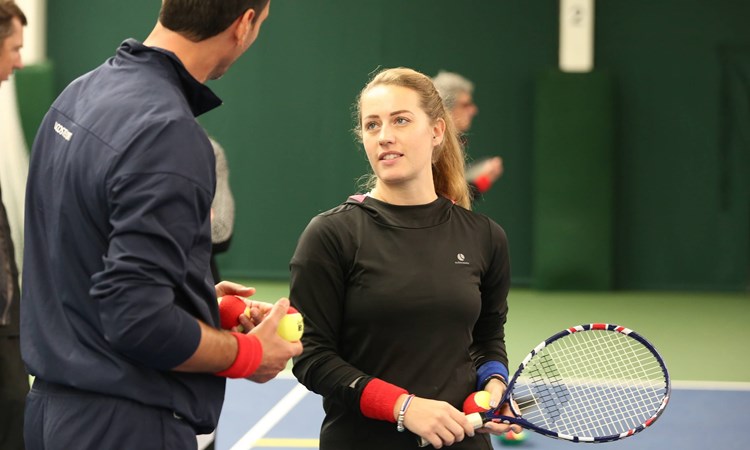 Two coaches chatting at coach conference