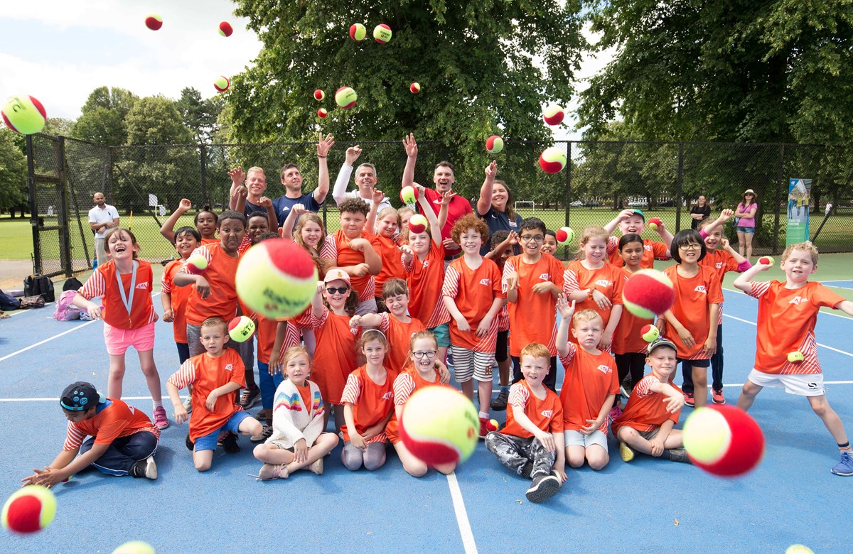 Summer kids throwing balls in the park