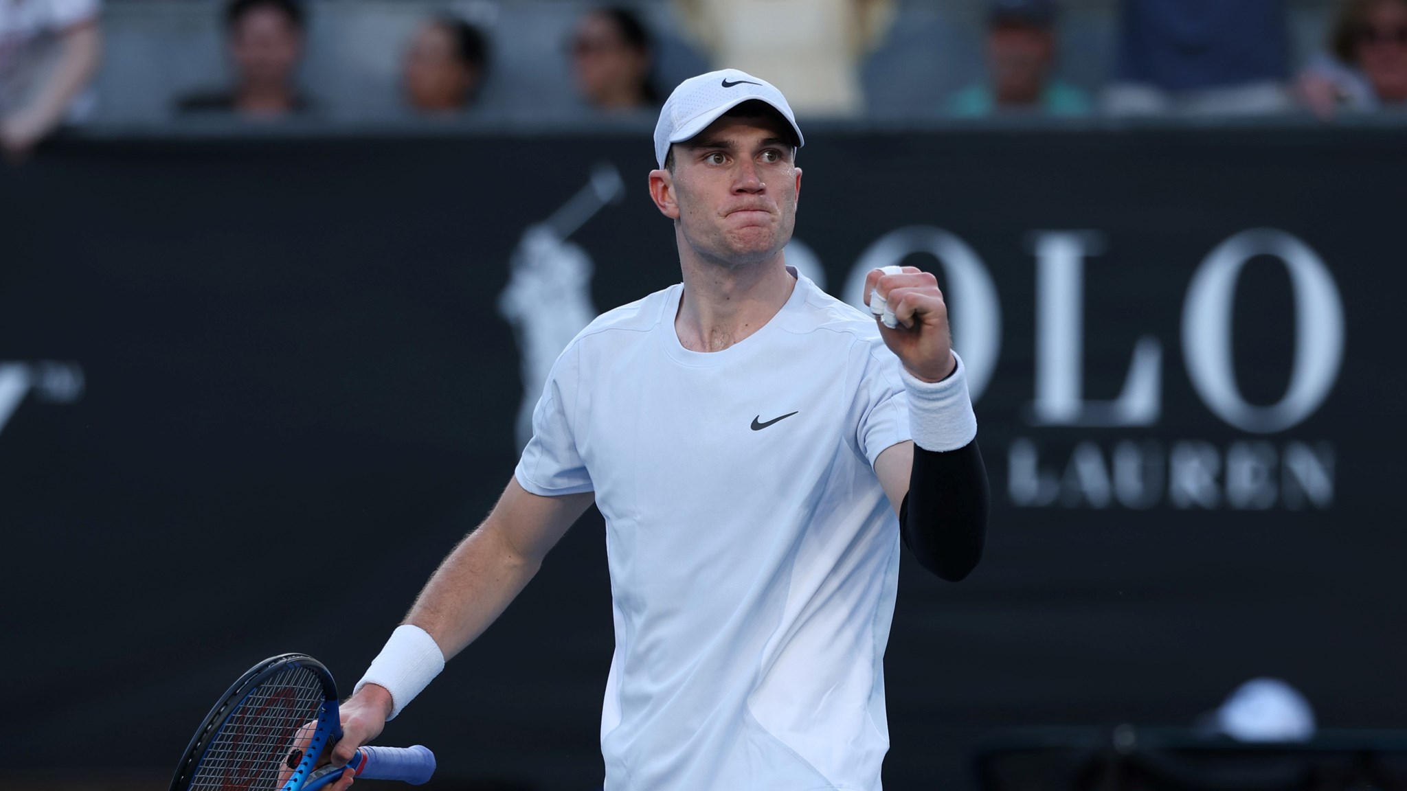 Jack Draper clenching his fist in celebration after defeating Mariano Navone in five sets in the first round at the 2025 Australian Open