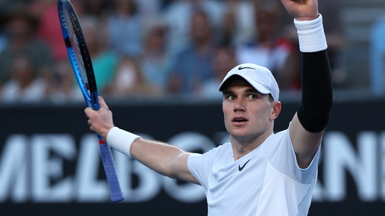 Jack Draper holding his hands up in the air in celebration after defeating Mariano Navone in the first round at the 2025 Australian Open