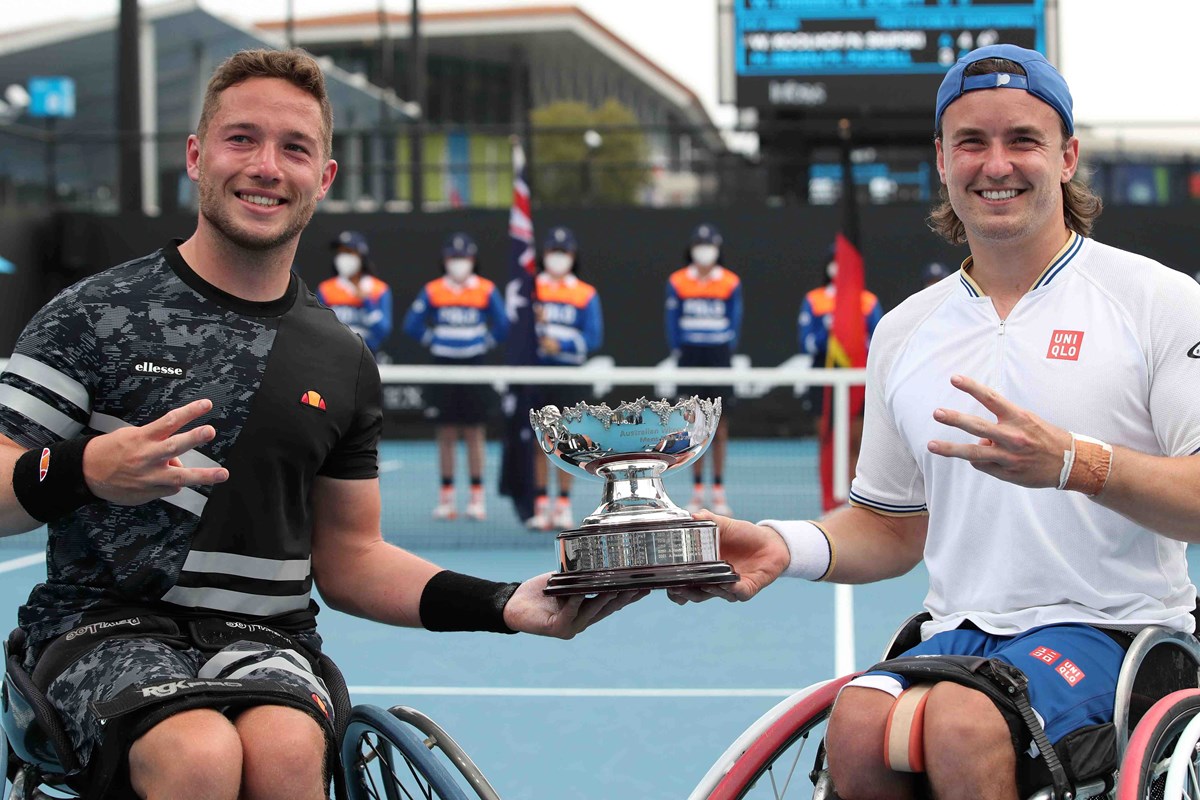 Alfie Hewett and Gordon Reid lifting the 2022 Australian Open Wheelchair doubles title