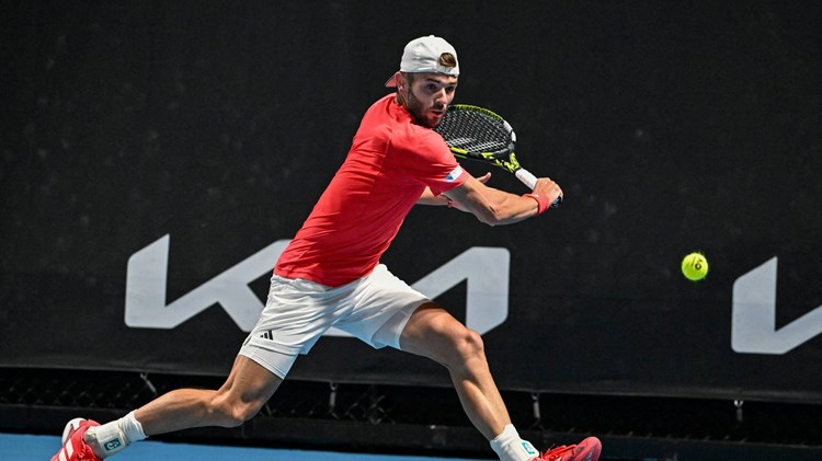 Jacob Fearnley reaches for a backhand during his second round win at the Australian Open