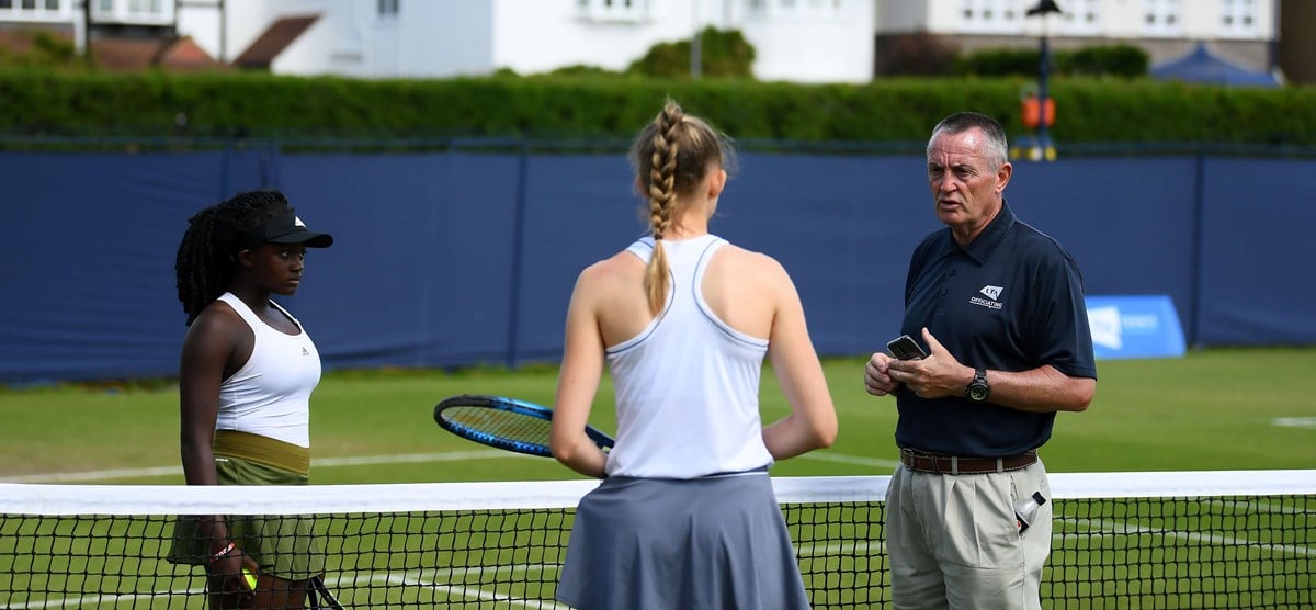 Match umpire talks to players.jpg