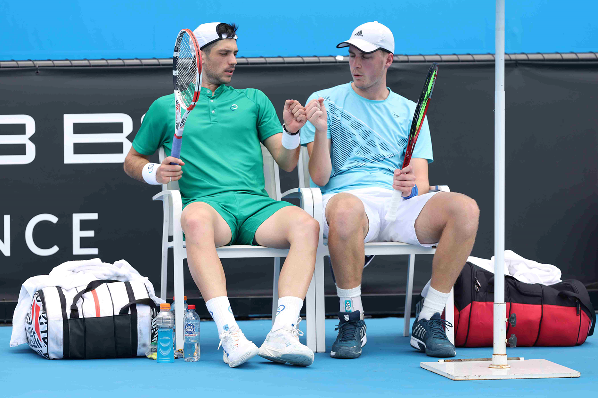 Henry Patten and Julian Cash fist bump on court