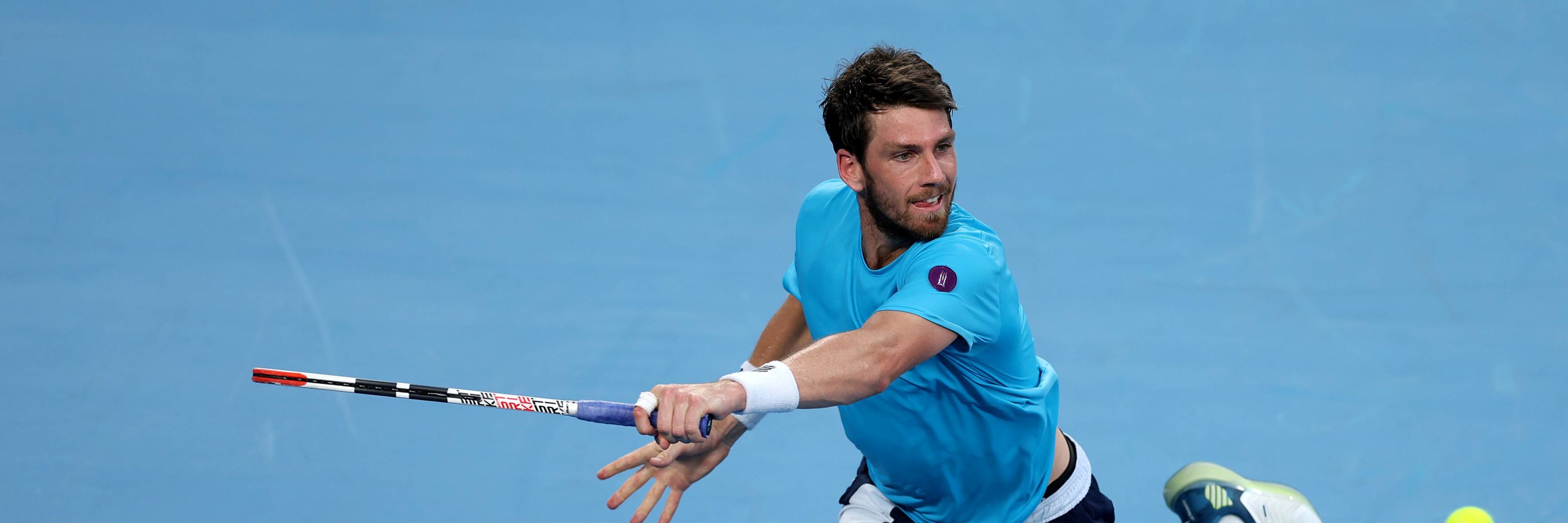 Cam Norrie reaches for a backhand in the opening round at the 2023 Australian Open