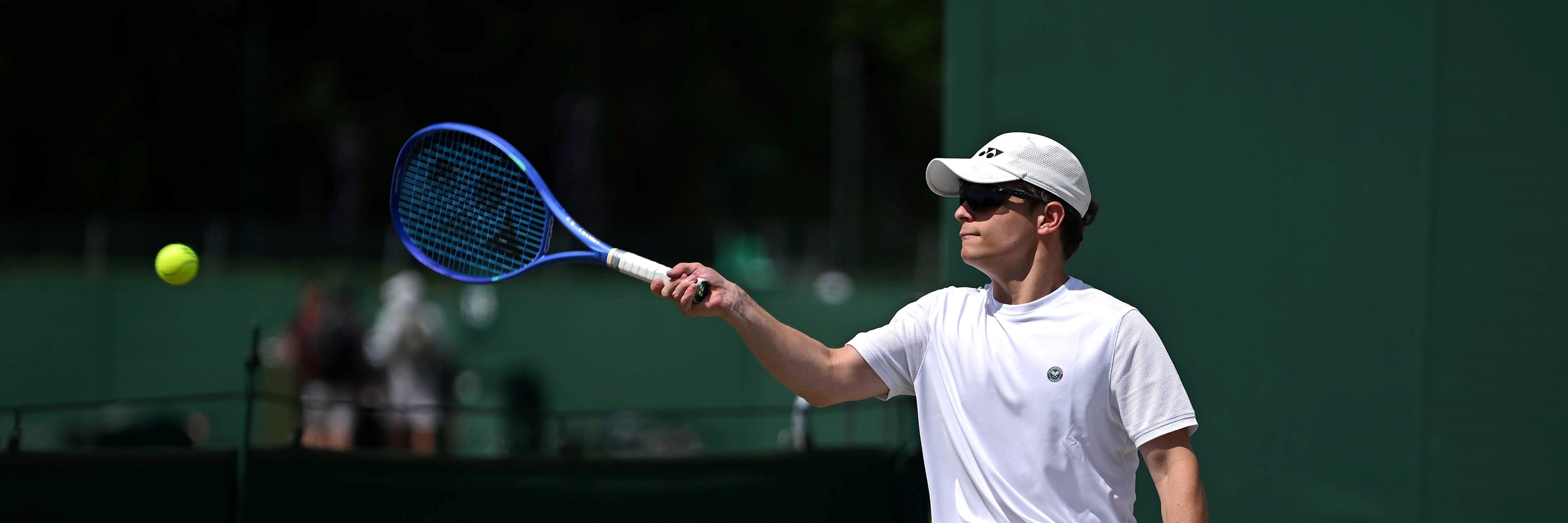 Greg Slade hits a forehand at Wimbledon
