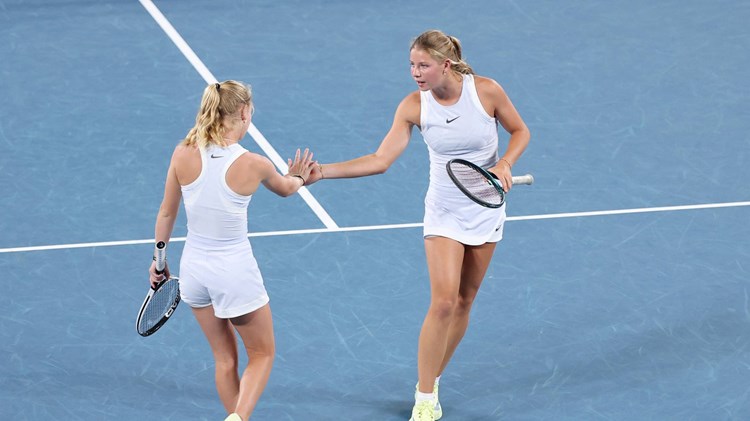 Hannah Klugman and Emerson Jones high five during the Australian Open semi-final