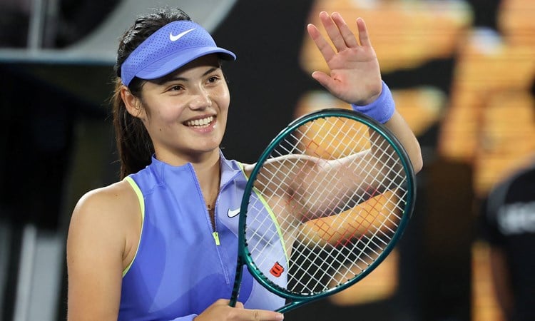 Emma Raducanu smiles and applaudes the crowd after a first round win at the 2026 Australian Open