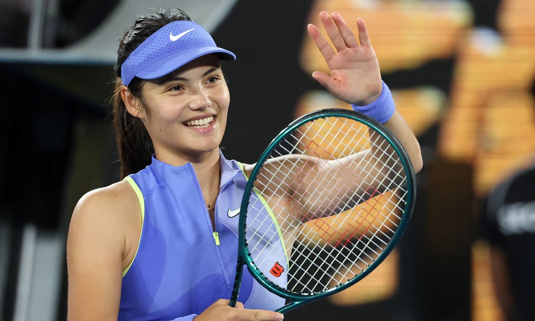 Emma Raducanu smiles and applaudes the crowd after a first round win at the 2026 Australian Open
