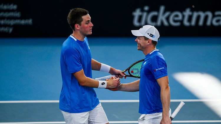 Henry Patten and Harri Heliovaara high five in the Adelaide International final
