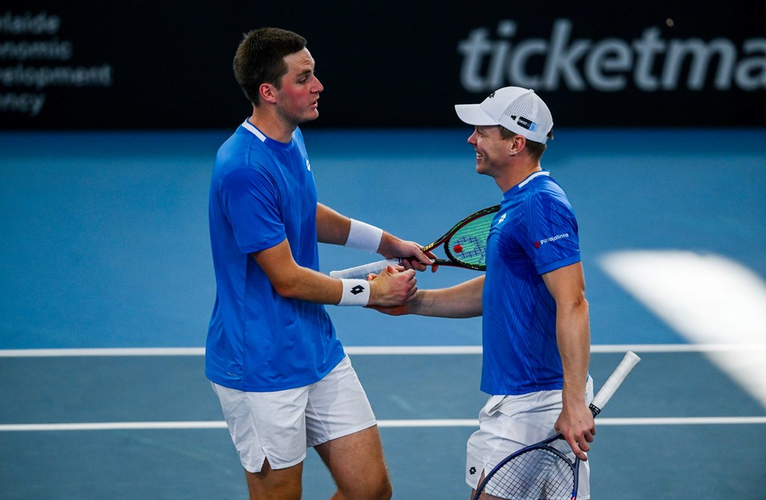 Henry Patten and Harri Heliovaara high five in the Adelaide International final