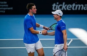 Henry Patten and Harri Heliovaara high five in the Adelaide International final