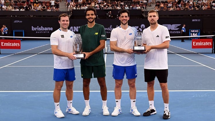 Julian Cash and Lloyd Glasspool holding the runner-up trophy at the Brisbane International