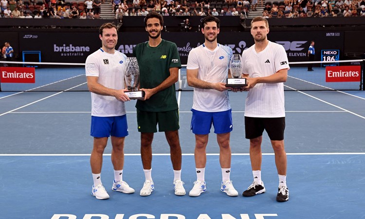 Julian Cash and Lloyd Glasspool holding the runner-up trophy at the Brisbane International