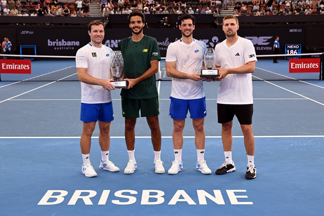 Julian Cash and Lloyd Glasspool holding the runner-up trophy at the Brisbane International
