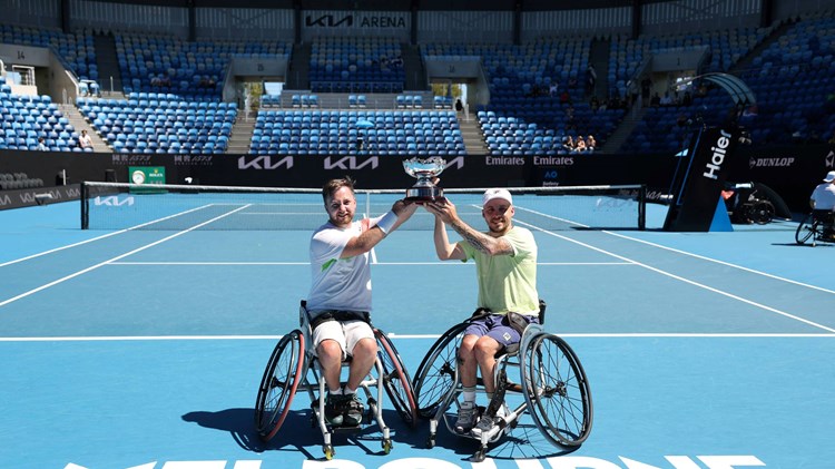 Sam Chroder and Andy Lapthorne holding the 2025 Australian Open quad doubles title