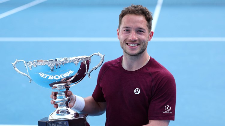 Alfie Hewett holding the 2025 Australian Open men's singles title