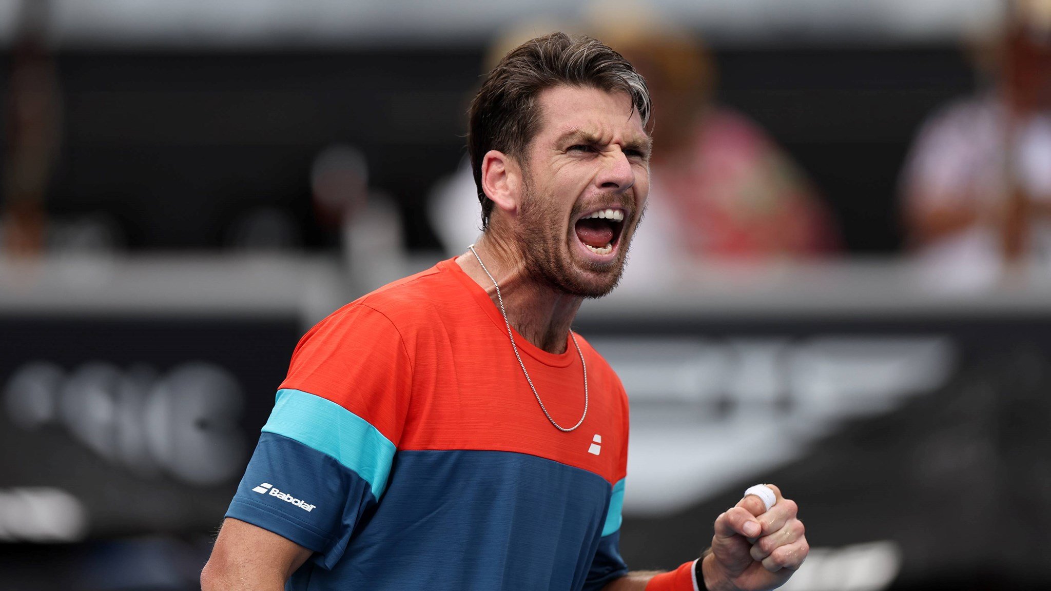 Cam Norrie roars in celebration after a win at the ASB Classic