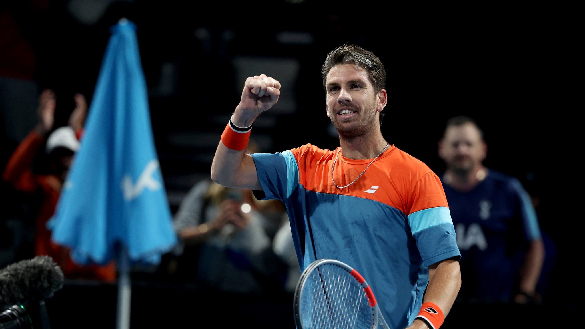 Cam Norrie pumps his fist in celebration to the crowd after a win at the Australian Open