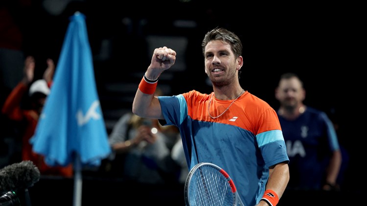 Cam Norrie pumps his fist in celebration to the crowd after a win at the Australian Open