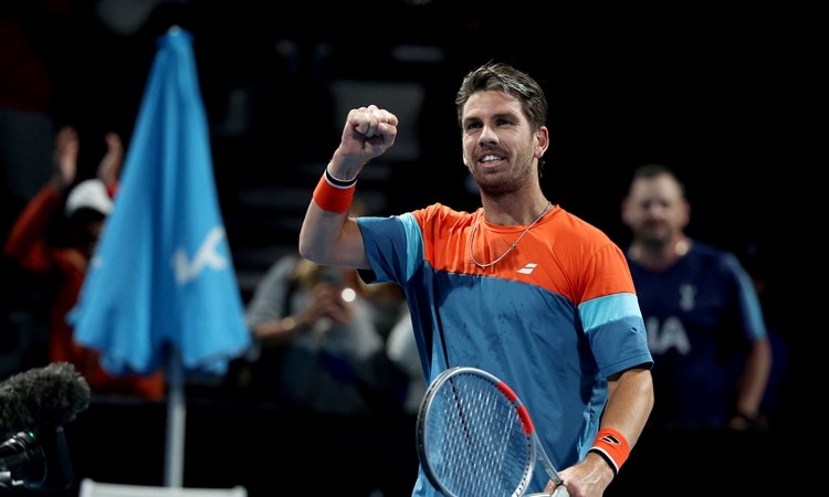 Cam Norrie pumps his fist in celebration to the crowd after a win at the Australian Open
