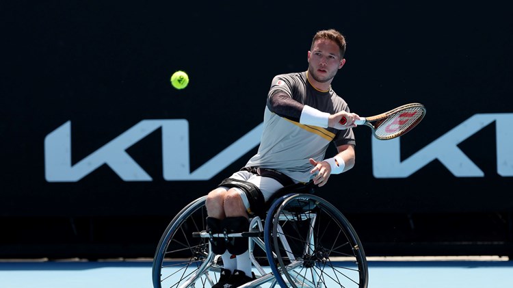 Alfie Hewett sat in his wheelchair while hitting a forehand on court at the Australian Open